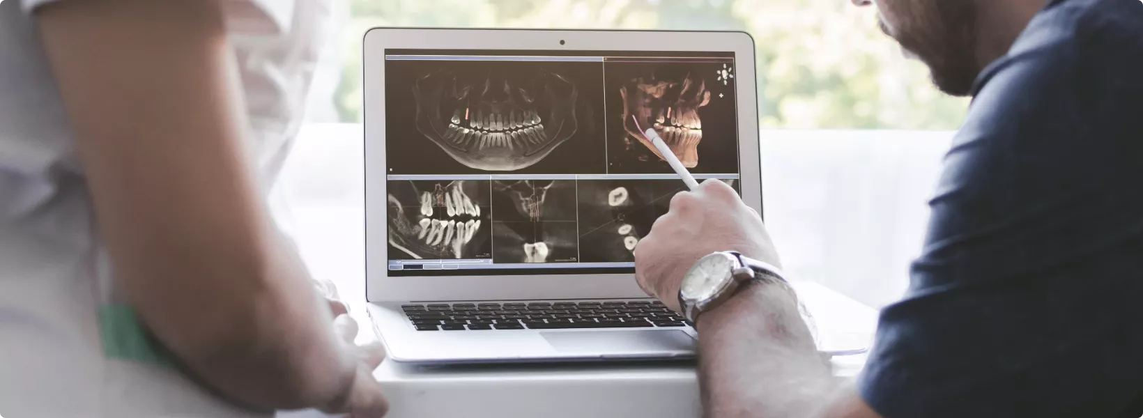 reviewing x-rays on a laptop